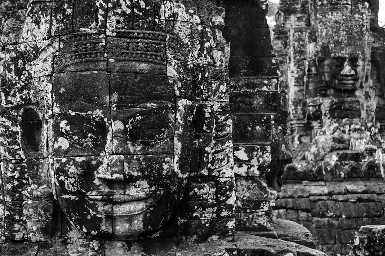 500px provided description: In my opinion the most amazing temple around Angkor, much more so than Angkor Wat. [#travel ,#bw ,#cambodia ,#m9 ,#bayon ,#pfig]